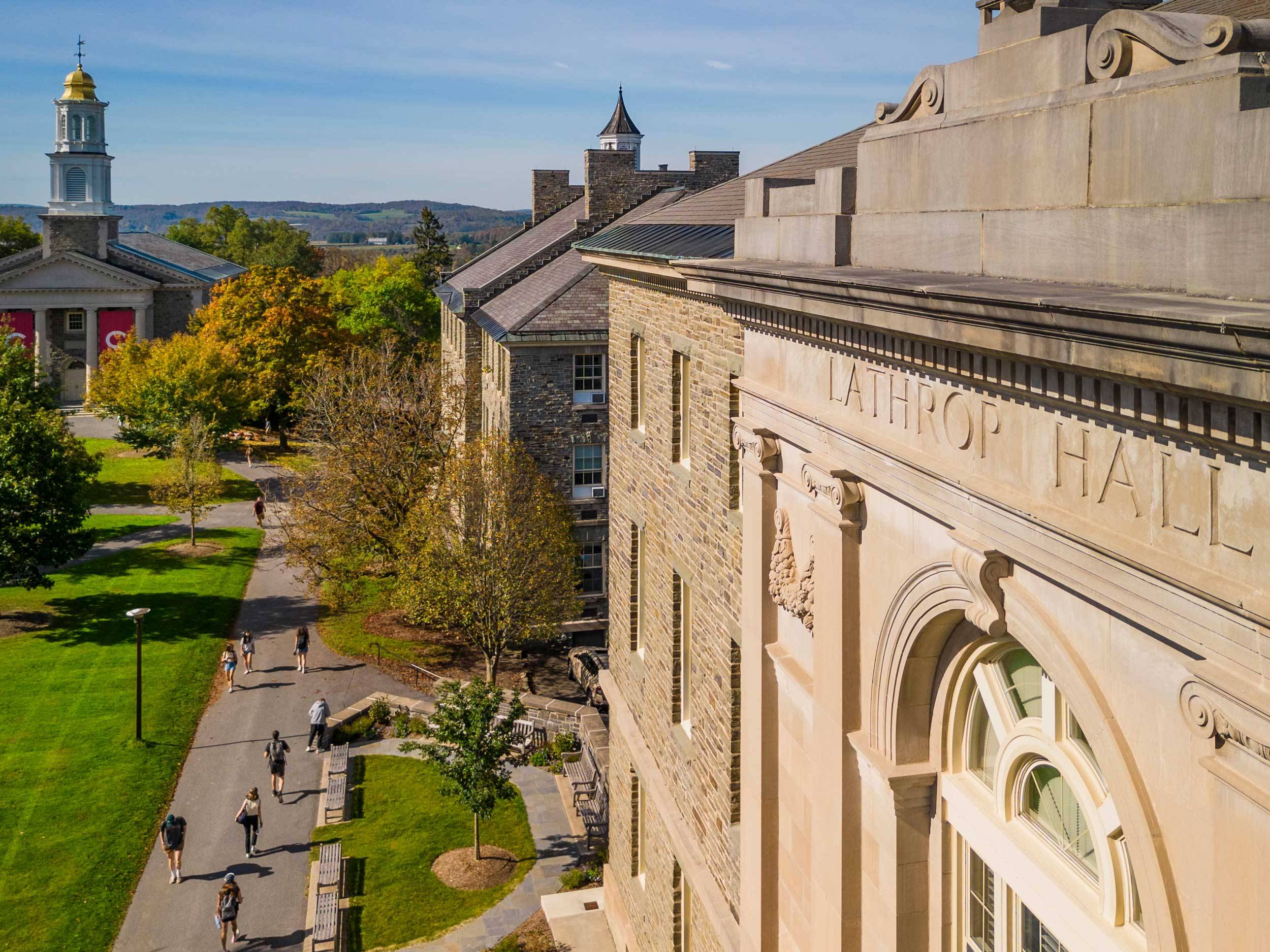Students make their way past Lawrence and Lathrop halls in between classes during an autumn morning.