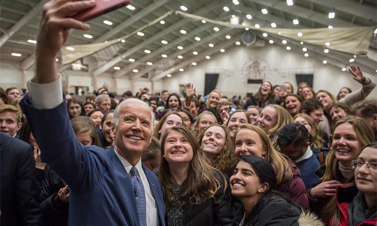 Former Vice President Joe Biden takes a photos with students during a 2017 visit to Colgate University.