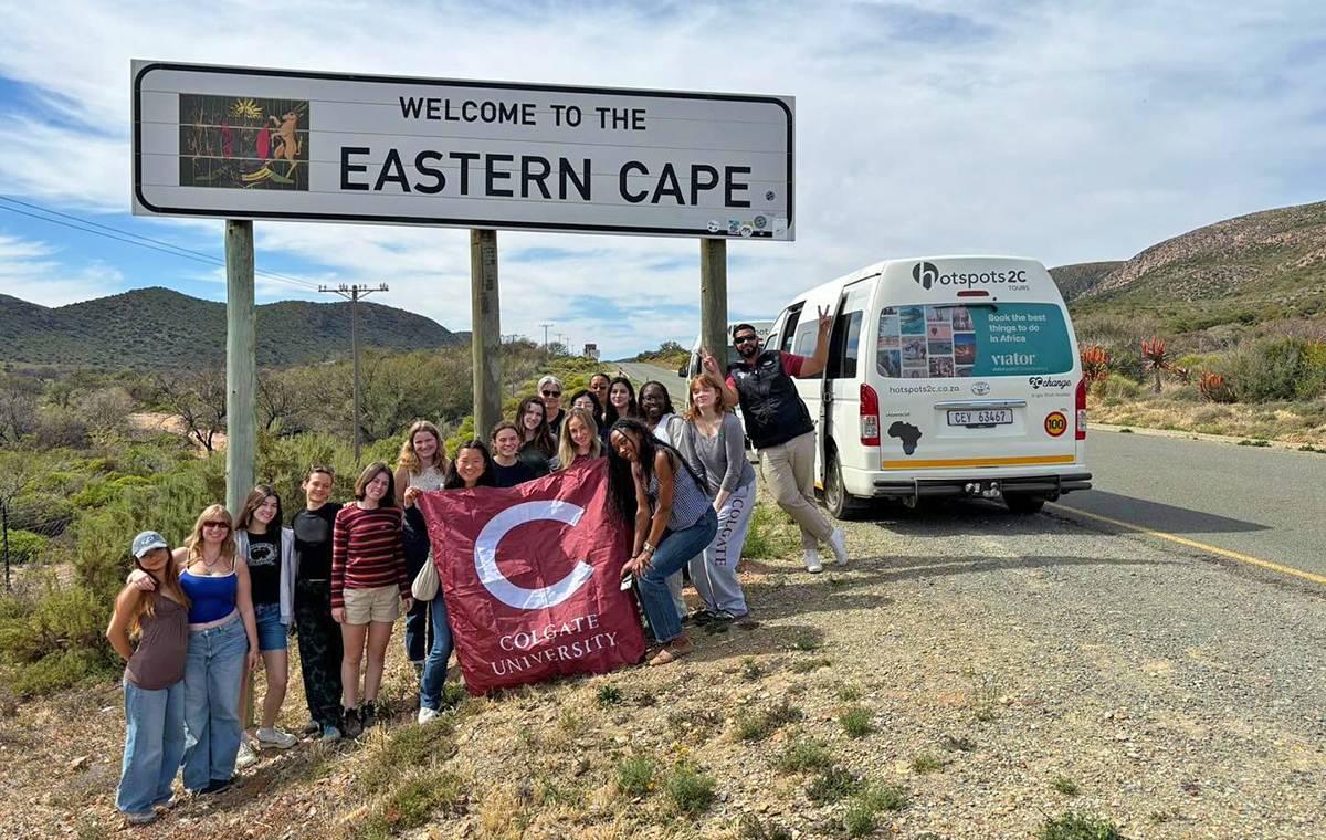 Colgate study group posing with Colgate flag in Eastern Cape, South Africa