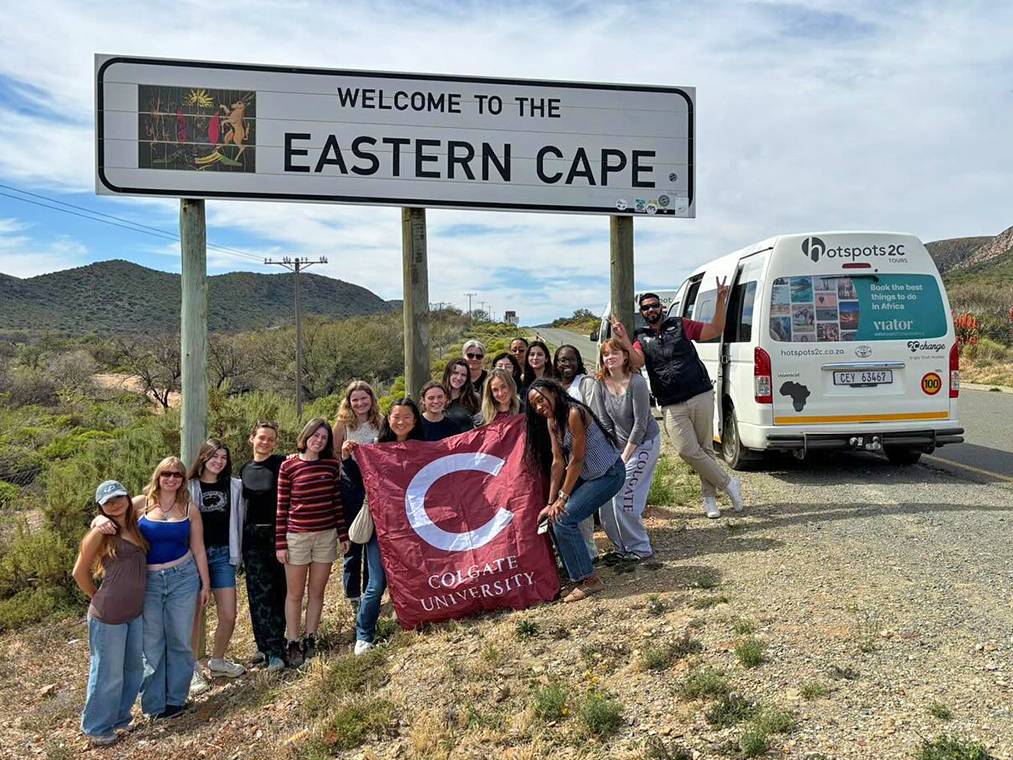 Colgate study group posing with Colgate flag in Eastern Cape, South Africa