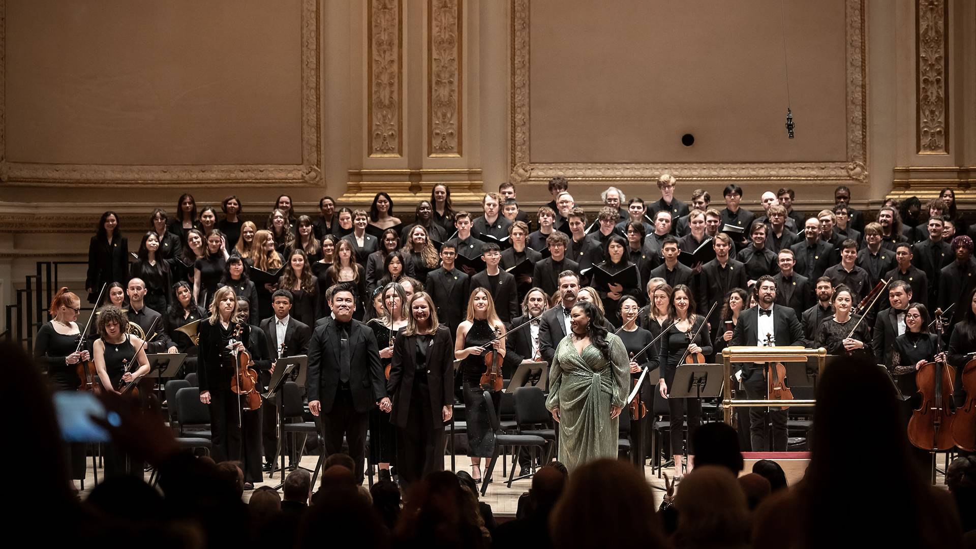 Colgate University Chorus and Hamilton College Choir taking a bow after their performance