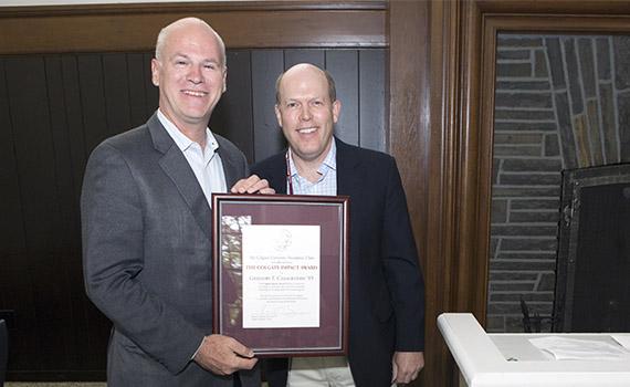 Casagrande accepts the Day of Impact Award from the Presidents' Club.