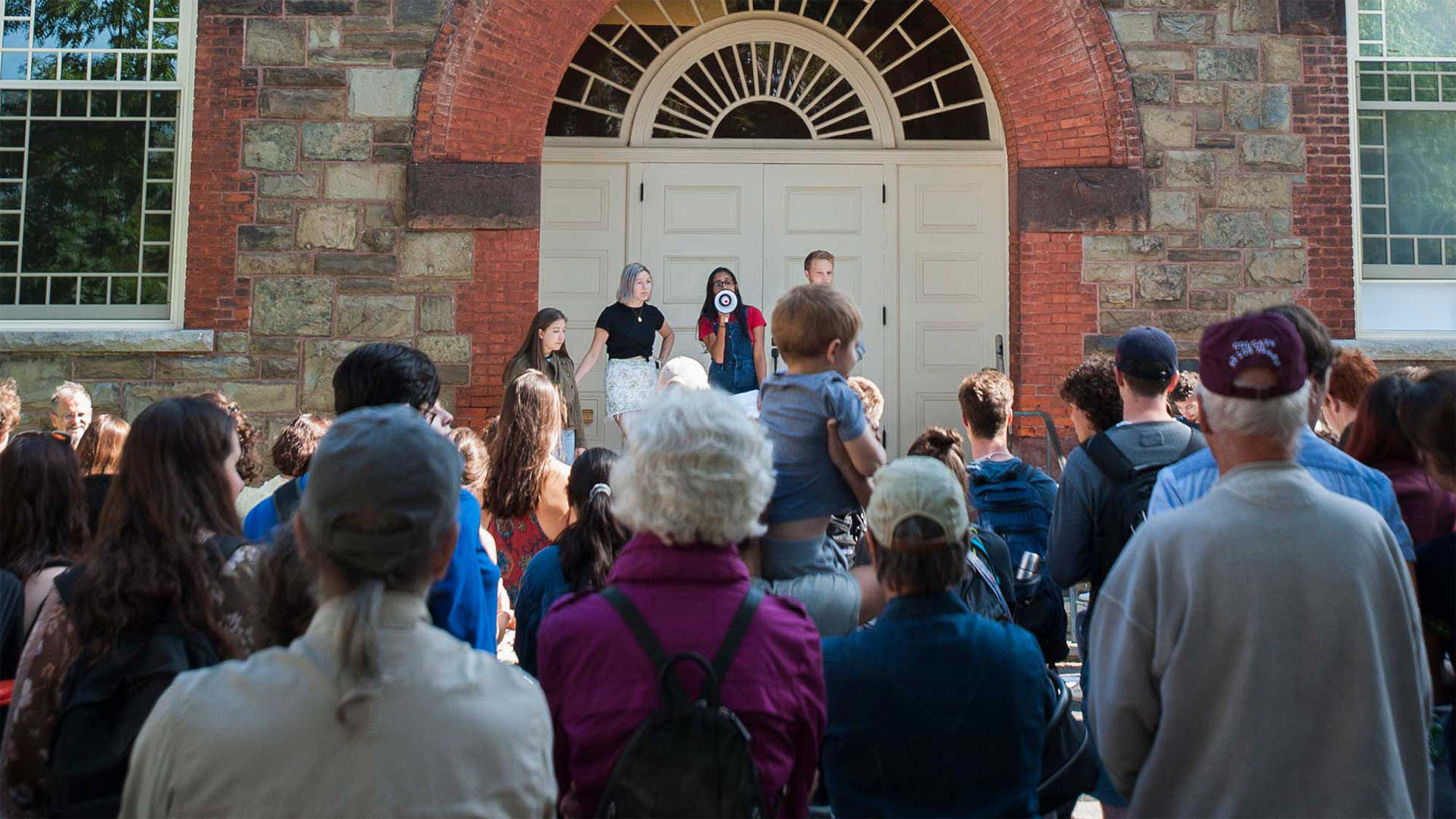 The leaders of Students for Environmental Action speak to the crowd at Colgate's climate strike.