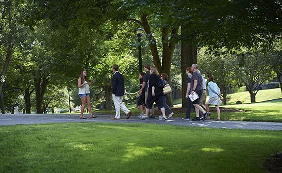 Katie Williams '15, a history and geography double major from Washington, D.C., leads a tour for prospective students and their families. Williams conducted research for her Geographic Information Systems course to determine the best campus tour route.