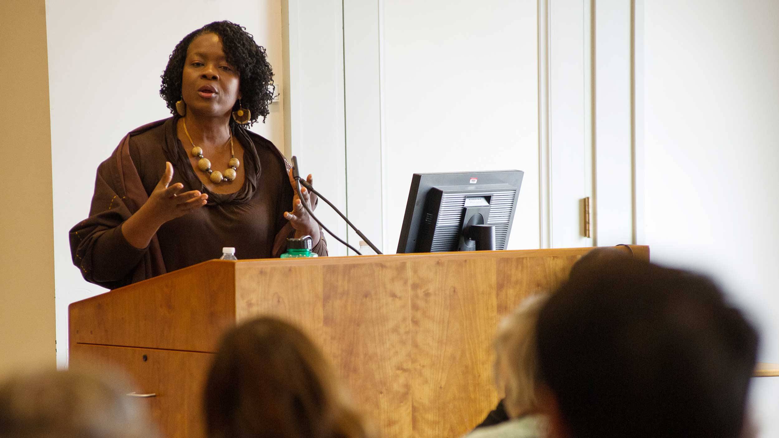 Professor Dianne Stewart ’90 speaks at classroom podium