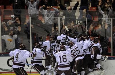 The Raiders celebrate Tyson Spink's winning goal in double overtime. (Photo by Bob Cornell)