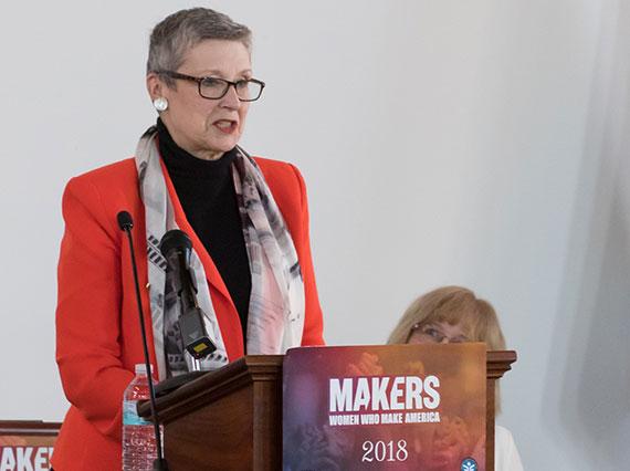 Professor Ellen Kraly at the podium