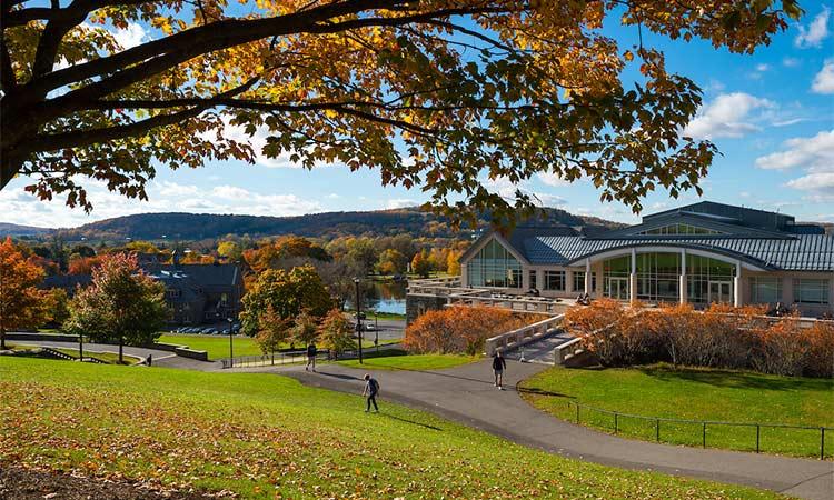 Students walk outside of Case Library in the fall