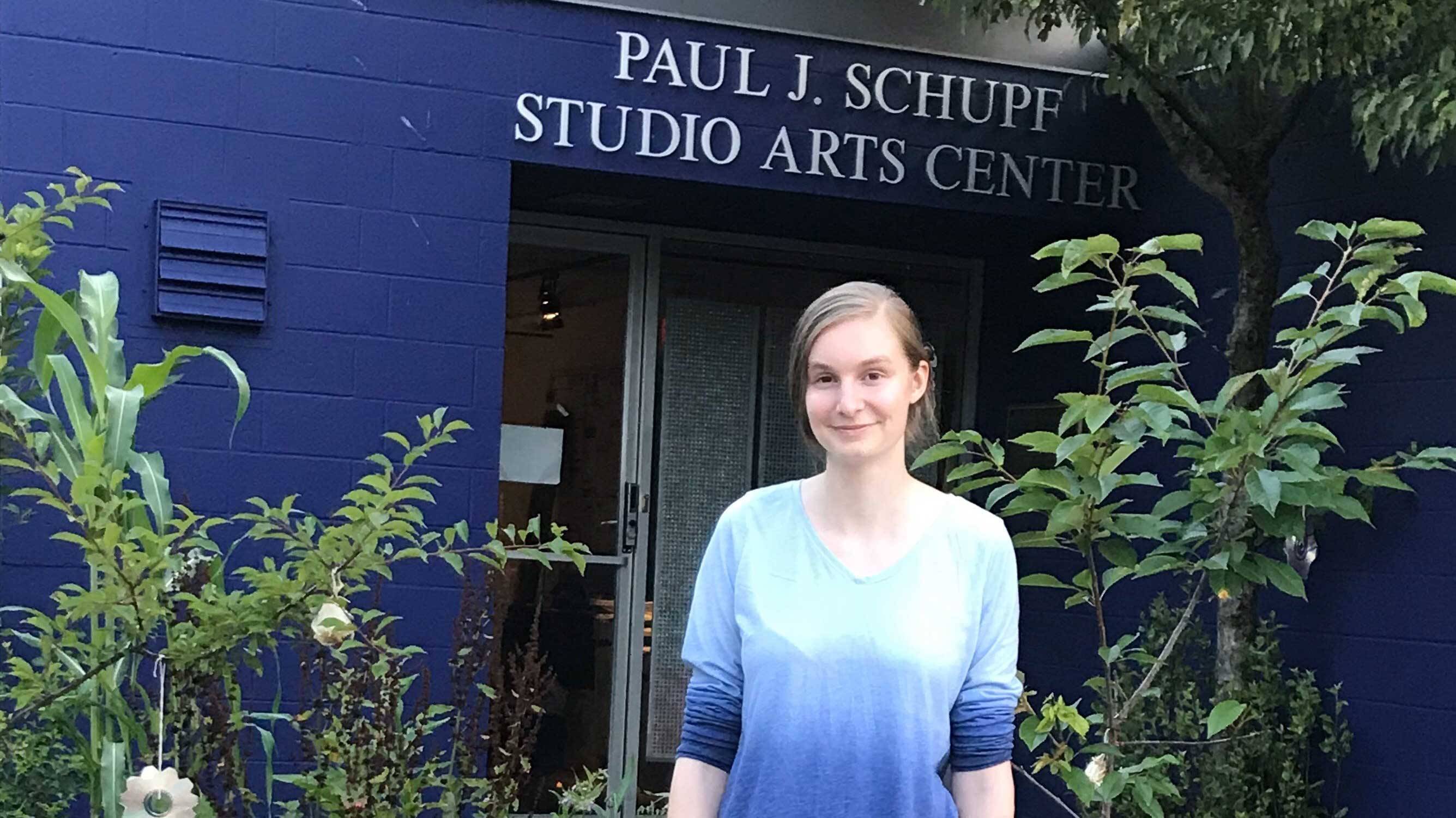 Keara Greene '20 in front of Schupf Studio Arts Center