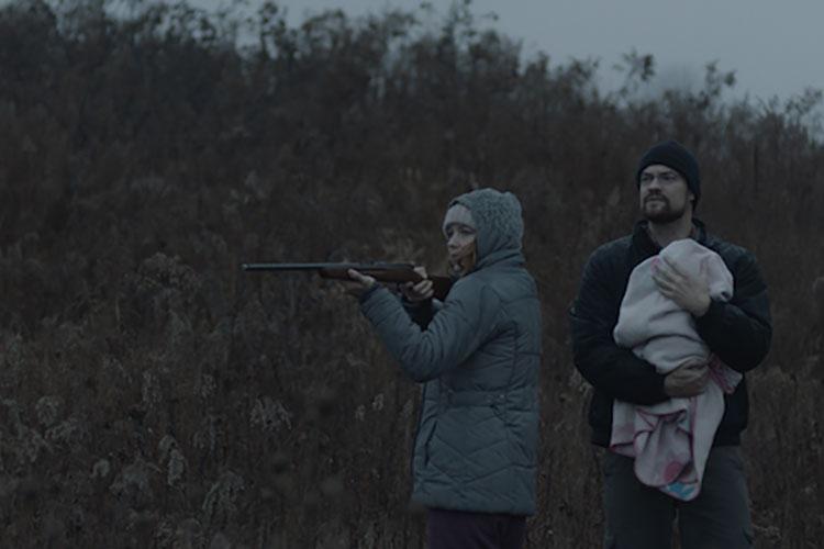 a still from the movie, this shot depicts two actors in a dark field