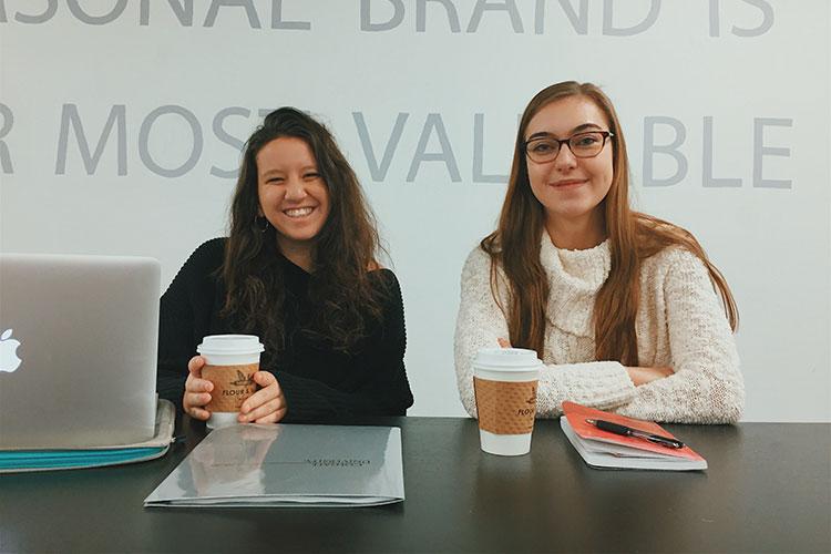 Two Colgate student entrepreneurs at a desk