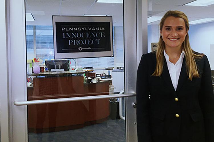 Student Madison Bailey standing in front of the Pennsylvania Innocence Project headquarters.