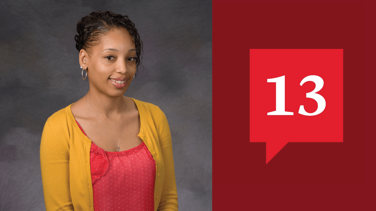 April Baptiste in a yellow cardigan with a coral top and grey background next to the 13 logo with a maroon background