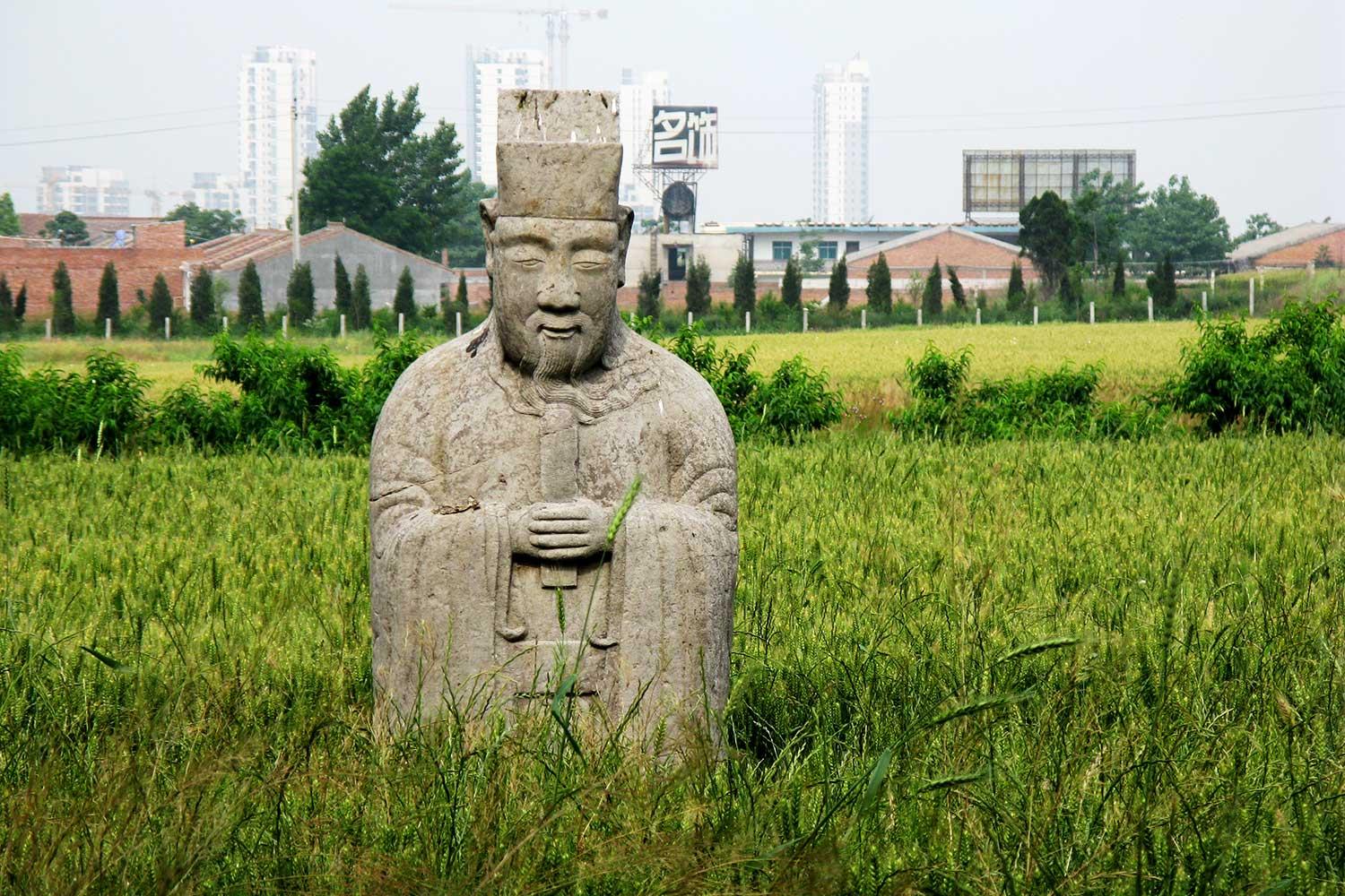 A half-buried funerary figurine from the tomb of the Ming Prince of Qin, outside today's Xi'an, the provincial seat of Shaanxi Province (Photo by David Robinson)