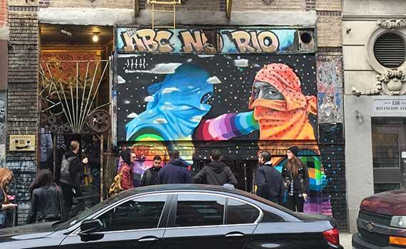 People standing outside on a street, waiting for a punk show to begin at ABC No Rio (Photo by Chandler Wood)