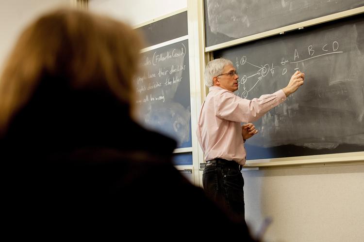 Professor Schult teaches a class in mathematics.