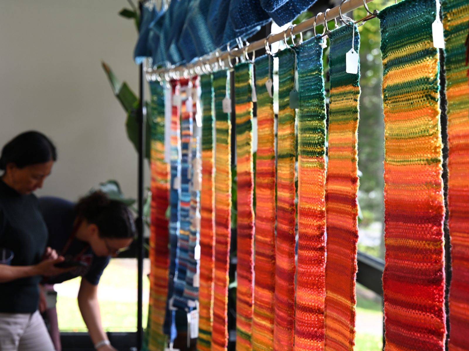 Finished Tempestry projects are displayed during an ENST Brown Bag, The Tempestry Project — Crafting Climate Communication, Sept 12. 