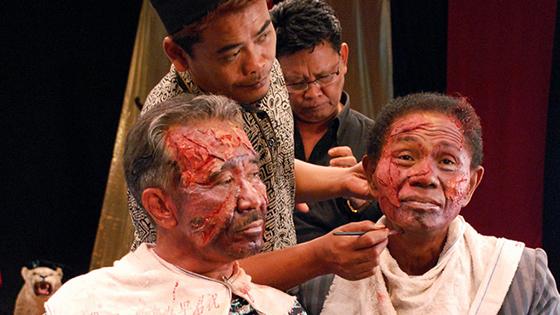 Two of the murderers featured in The Act of Killing, Adi Zulkadry (left) and Anwar Congo (right), have makeup applied for their scenes.