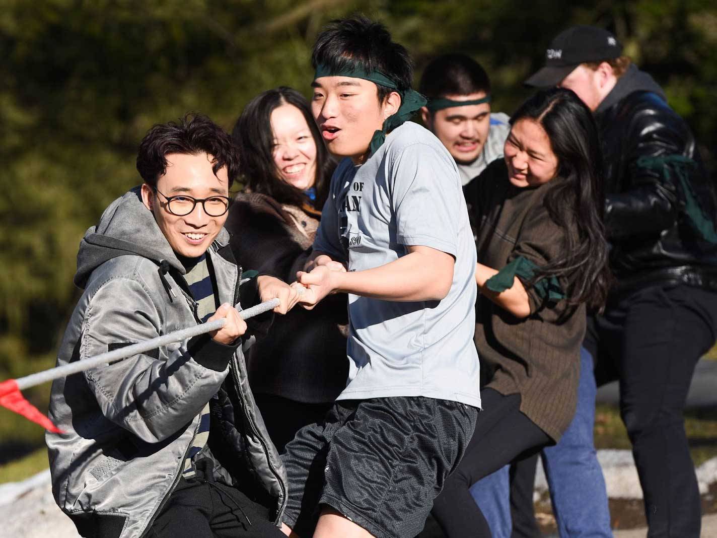 Green team competing in Undoukai championship game of tug-a-war