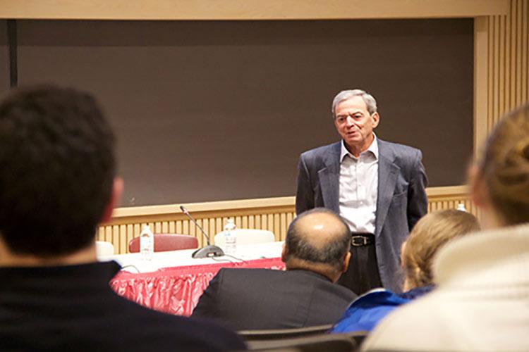 Wolk Medical Conference attendees ask a question of Michael J. Wolk '60.