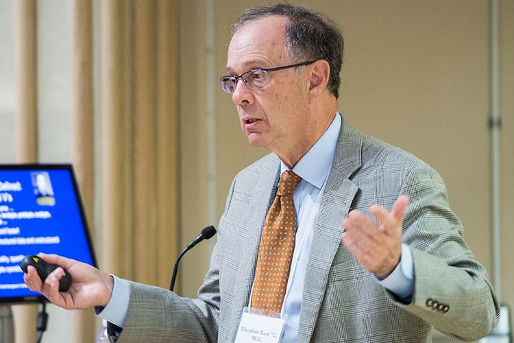 Dr. Theodore Bass ’72 stands at podium delivering 2017 Wolk Conference keynote