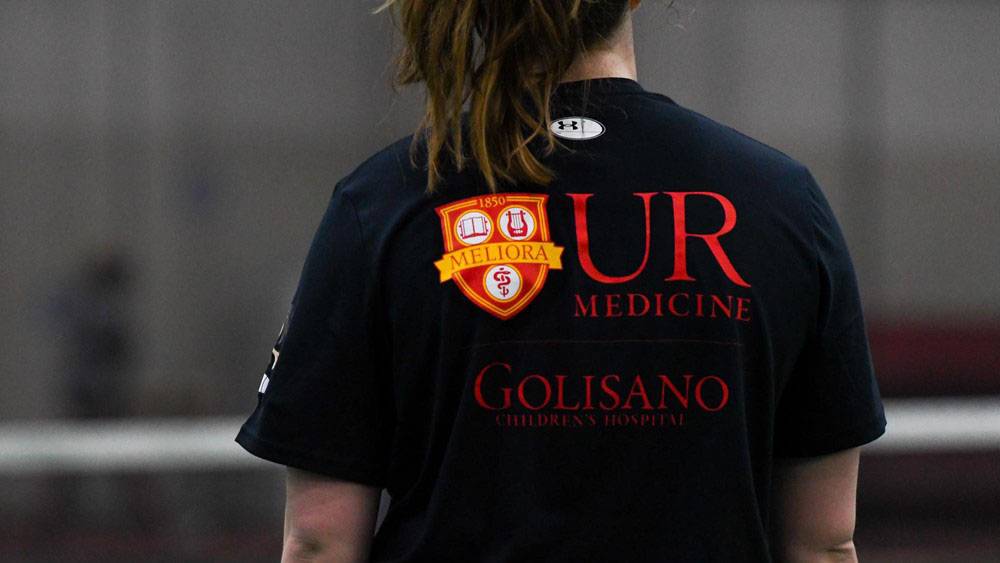 Student-athlete wears Golisano shirt