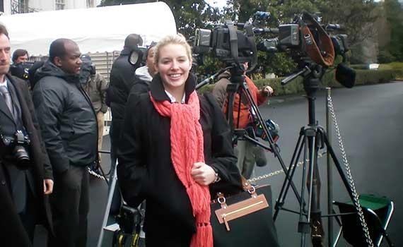Emily Bradley ’10 stands with the press corps outside the White House