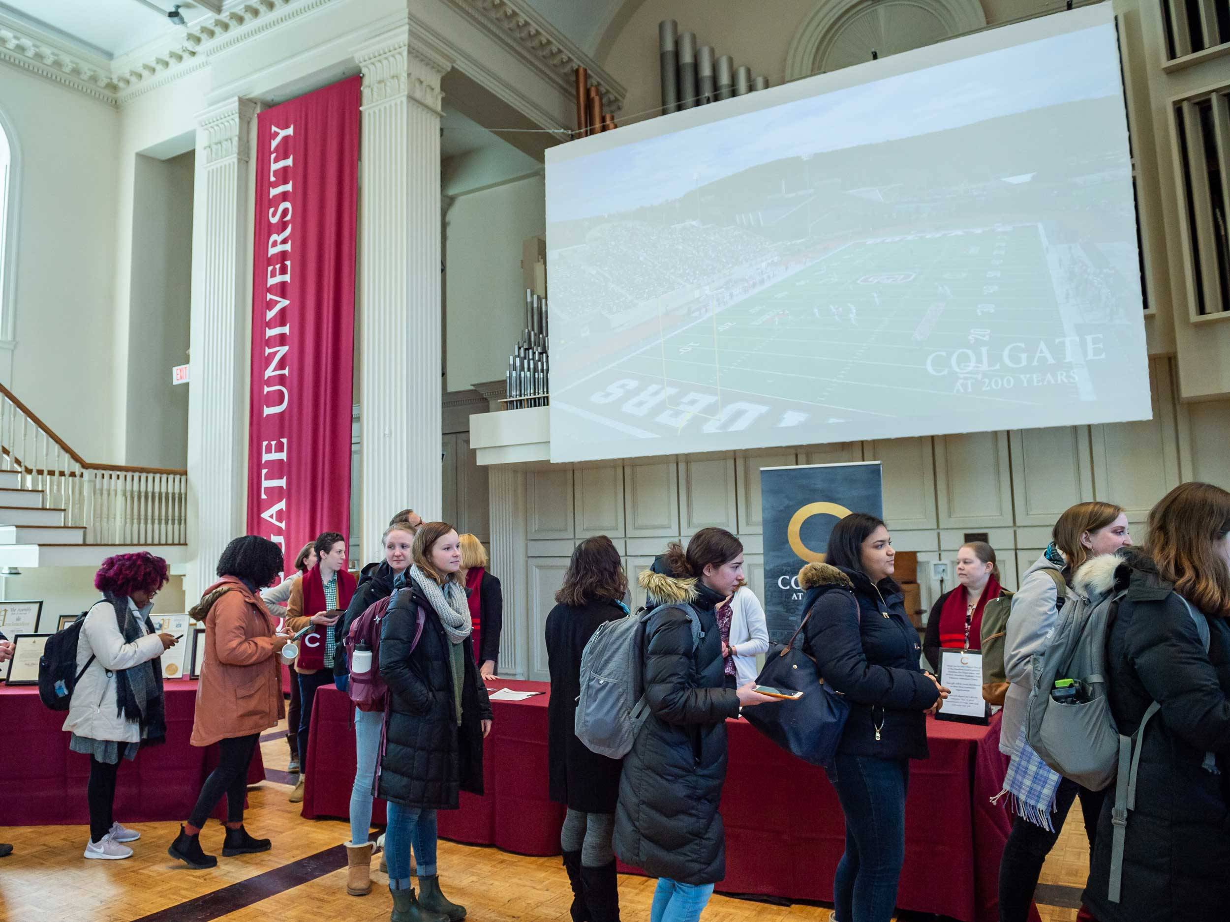 Colgate community members line up to celebrate Charter Day in Memorial Chapel