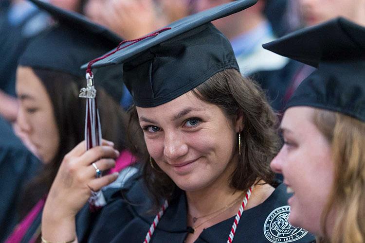 A student moves her tassel at the 2018 commencement ceremony