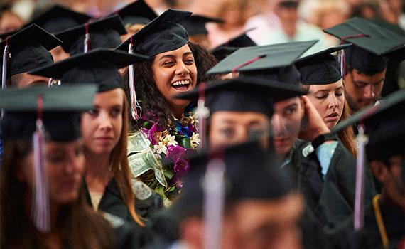 Graduates laugh during Commencement 2015