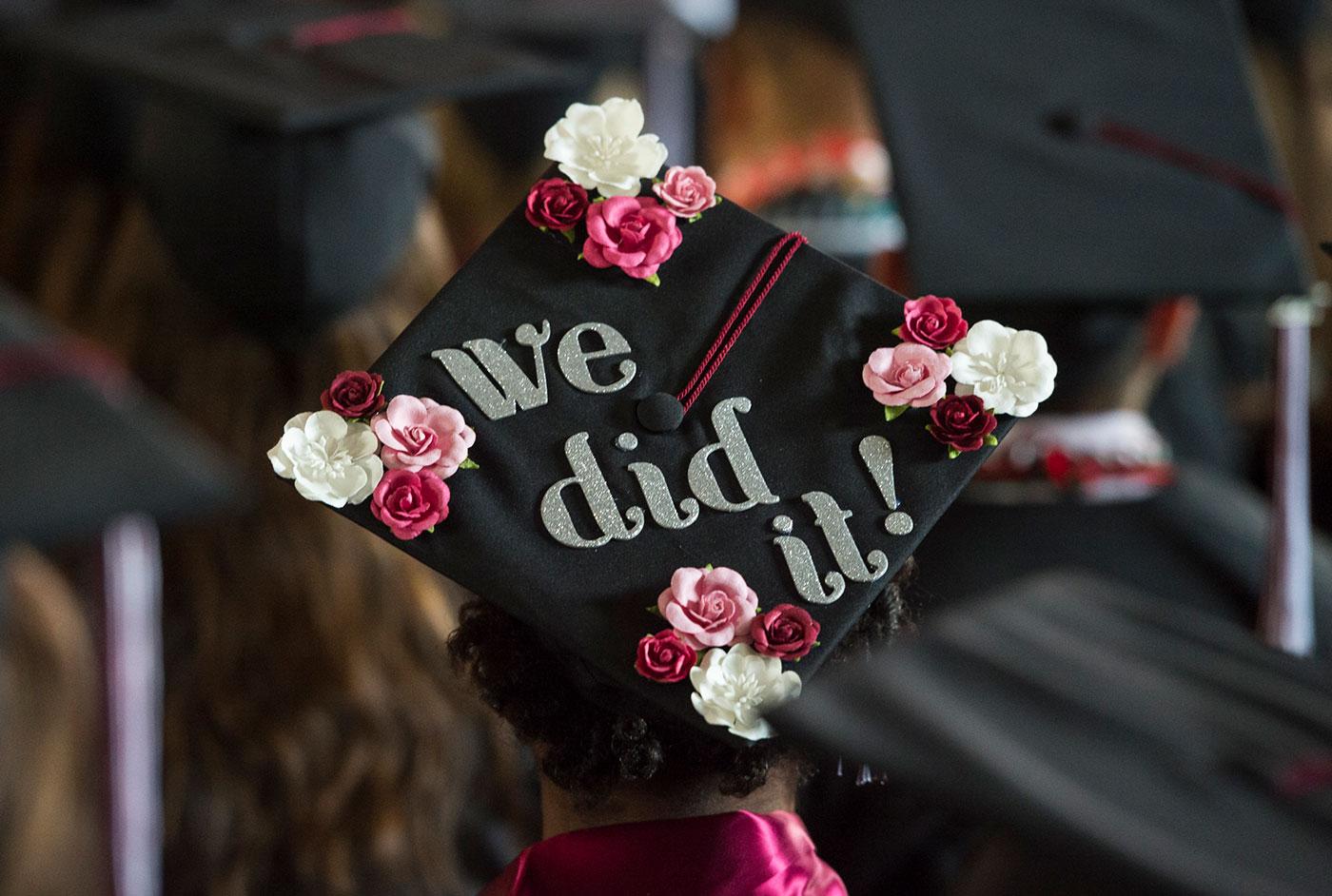 back of graduation cap reading "we did it!"