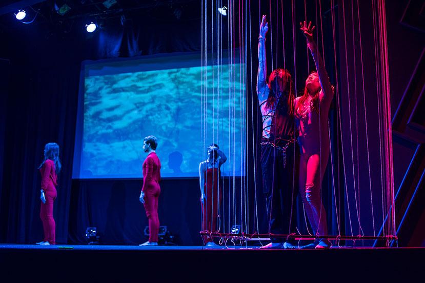 Dao Anh Khanh performing on stage with Colgate students at the Palace Theater