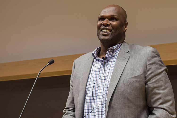 Adonal Foyle ’98 stands at podium