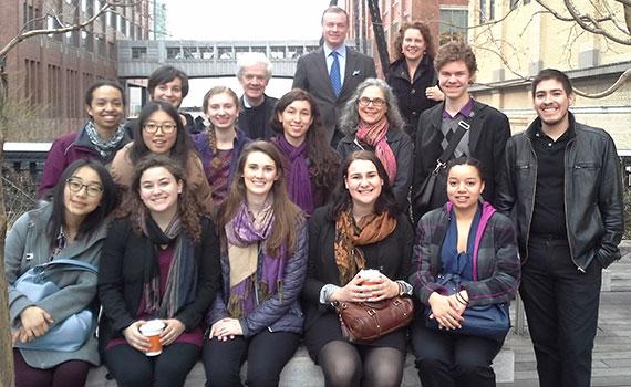 Group portrait of students, faculty, and alumni standing on the Highline in New York City