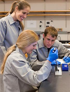Colgate biology professor Krista Ingram works with students in her lab.