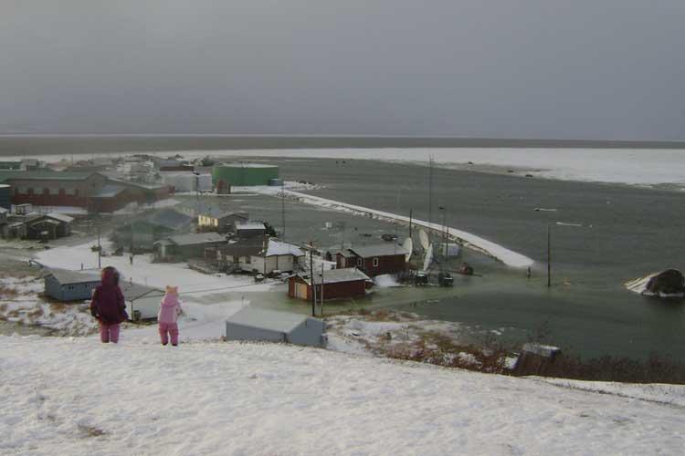 Ocean waters encroach on buildings in Golovin, Alaska