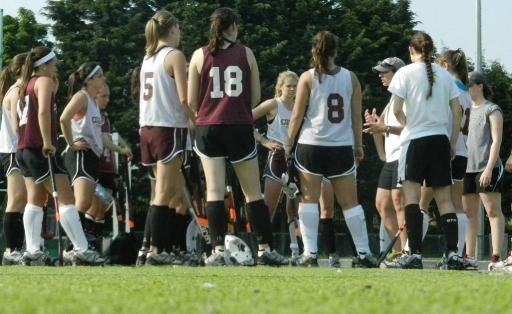 Coach Cathy Foto talks to the team at the Railway Union Hockey Club field in Dublin.