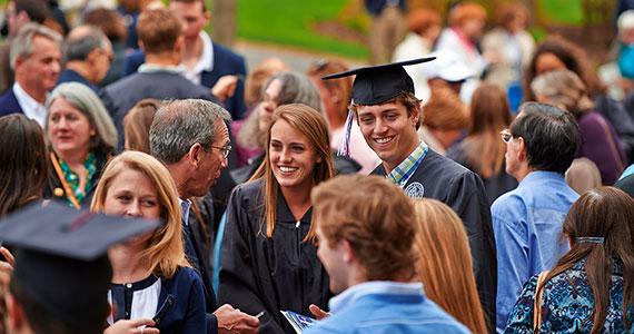 Graduates enjoy time with friends and families. (Photo by Andy Daddio)