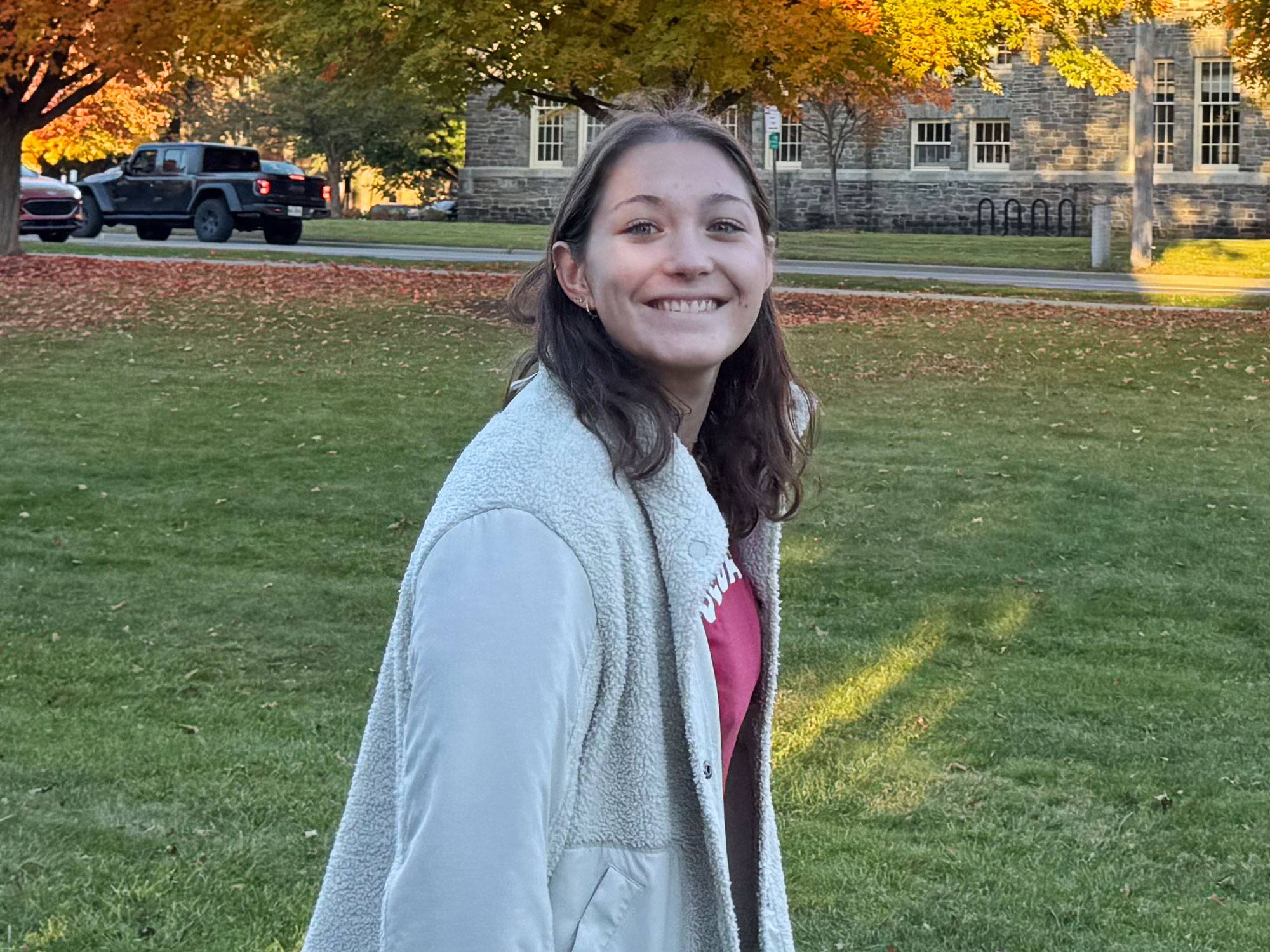 Patti Rizzo ’26 walking on grassy lawn