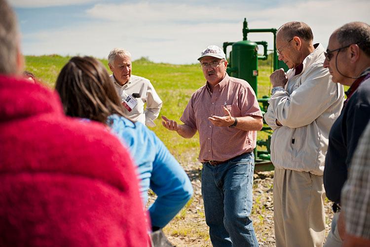 Bruce W. Selleck, Thomas A. Bartlett Chair and Professor of Geology, tours a local natural gas well with alumni during Reunion 2011.