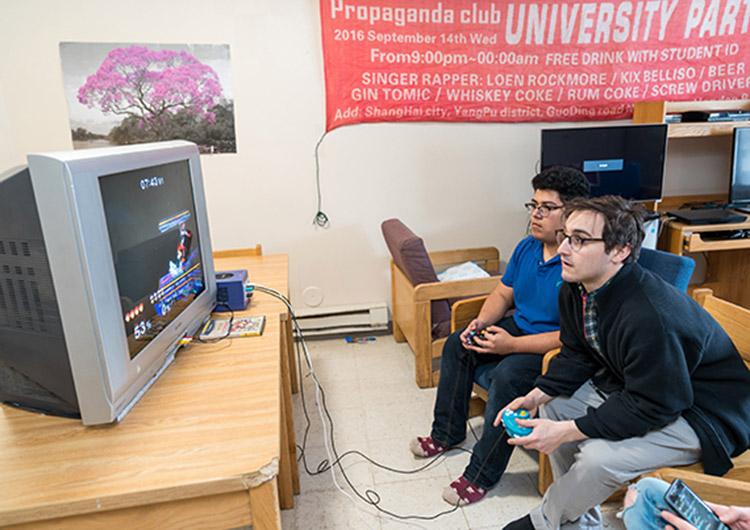 Two Colgate students play a video game
