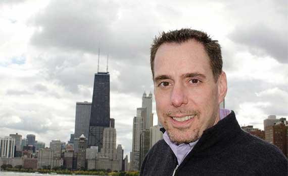 Jeffrey Sumber ’92 stand in front of a cityscape