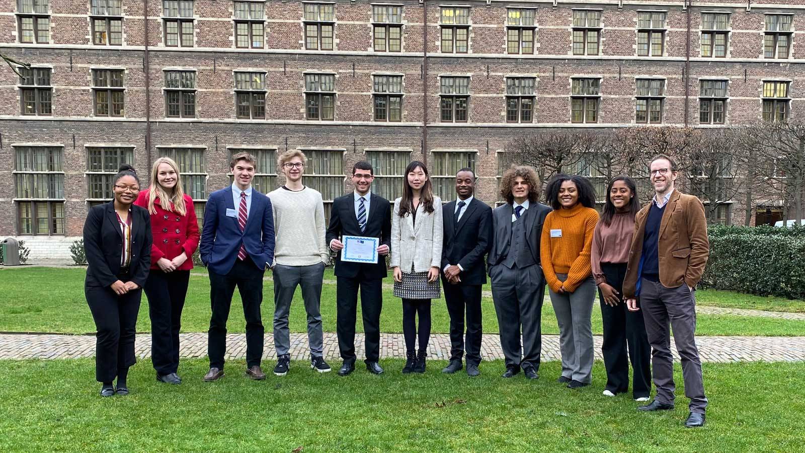 EuroSim participants stand in front of campus building in Antwerp