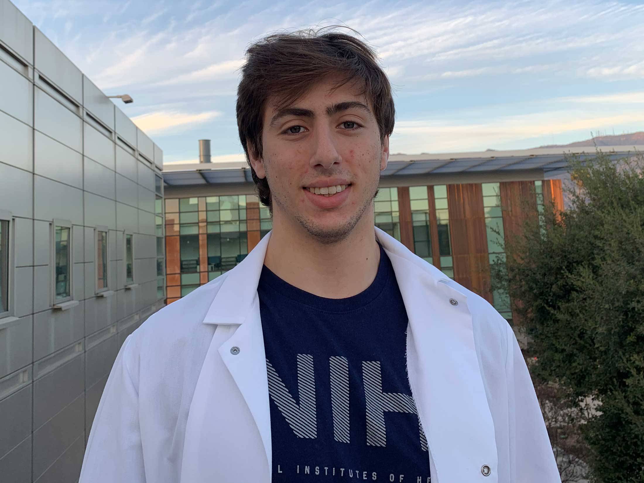 Portrait of William Rosencrans ’19 in lab coat